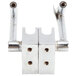 A metal hinge with holes on a white surface.