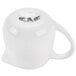 A white porcelain creamer with a handle.