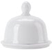 A bright white porcelain butter dish with a dome-shaped lid.