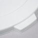 A close up of a white Continental Huskee trash can lid with a white plastic handle.