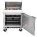 A Beverage-Air stainless steel refrigerated sandwich prep table with a door open.