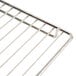 A stainless steel metal rack with wire shelves.