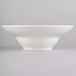 A white Homer Laughlin China bowl with a small rim on a white surface.