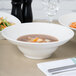 A close-up of food in a Homer Laughlin bright white china bowl.