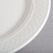 A close-up of a Homer Laughlin Kensington Ameriwhite bright white china plate with a pattern.