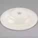 A close-up of a Homer Laughlin ivory china soup bowl with a rolled edge.
