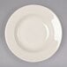 A Homer Laughlin ivory china bowl with a curved edge.