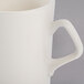 An ivory Troy China mug with a handle.