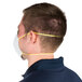 A man wearing a Cordova N-95 particulate respirator with yellow straps.