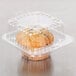 A muffin in a Polar Pak clear plastic takeout container.