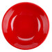 a red plate with a circle in the middle