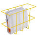 A yellow Noble Products wire rack holding papers and folders.