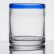 A Libbey clear rocks glass with a cobalt blue rim.