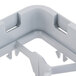 A grey plastic corner piece with two holes.