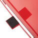 A red metal Rubbermaid medical step can with a black lid pad.