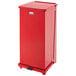 A red Rubbermaid medical step can with a lid.
