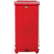 A red rectangular Rubbermaid medical step can with a lid.