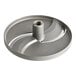 A grey circular metal object with a hole in the center.