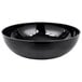 A black Cambro ribbed serving bowl.