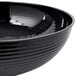 a black bowl with a white background