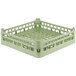 A Vollrath light green plastic dish rack with holes.