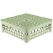 A Vollrath light green plastic dish rack with open sides and four compartments.