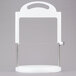 A white plastic stand with a metal pole for cheese slicing.