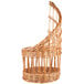 A close-up of a Matfer Bourgeat round wicker bread basket with a curved top.