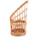 A Matfer Bourgeat round wicker bread basket with a curved handle.