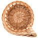A Matfer Bourgeat round wicker bread basket with a handle.
