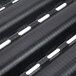 A close-up of a black metal Matfer Bourgeat baguette pan with six long compartments.