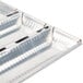 A close up of a silver Matfer Bourgeat baguette pan with 6 compartments.