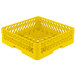A Vollrath Traex yellow plastic dish rack with handle and holes.