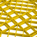 A yellow plastic Vollrath Traex dish rack with square holes.
