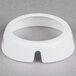 A white circular Tablecraft salad dressing dispenser collar with beige lettering.