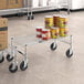 A Regency mobile dunnage rack with cans of food on it.