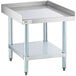 A Regency stainless steel equipment stand with a galvanized shelf.