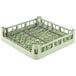 A light green Vollrath dish rack with metal handles.