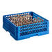 A blue plastic Vollrath dish rack with many rows of pegs inside.