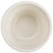 A white bowl with a green stripe on the rim.