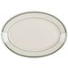 A white oval platter with green stripes on the rim.