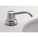 A close-up of a Bobrick deck mounted soap dispenser above a white surface.
