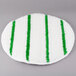 A white and green striped carpet bonnet with green scrubber strips.