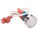 A red and white Roundup momentary switch with wires.