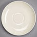 A white Homer Laughlin saucer with a circular edge.