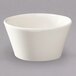 A white Homer Laughlin china bouillon cup on a gray surface.