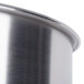 A close-up of a stainless steel bowl with a silver surface.