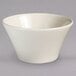 A white bowl with a curved edge on a white background.