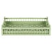 A light green plastic flatware rack with a handle and vent.