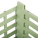 A light green plastic Vollrath dish rack with metal bars.